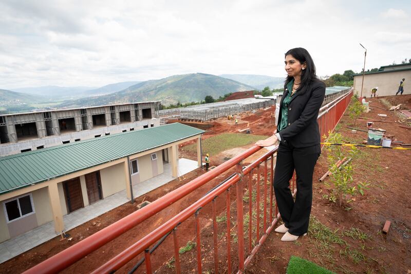 Ms Braverman at a building site on the outskirts of Kigali during her visit to Rwanda in March to see houses being constructed that could eventually house deported migrants from the UK. PA