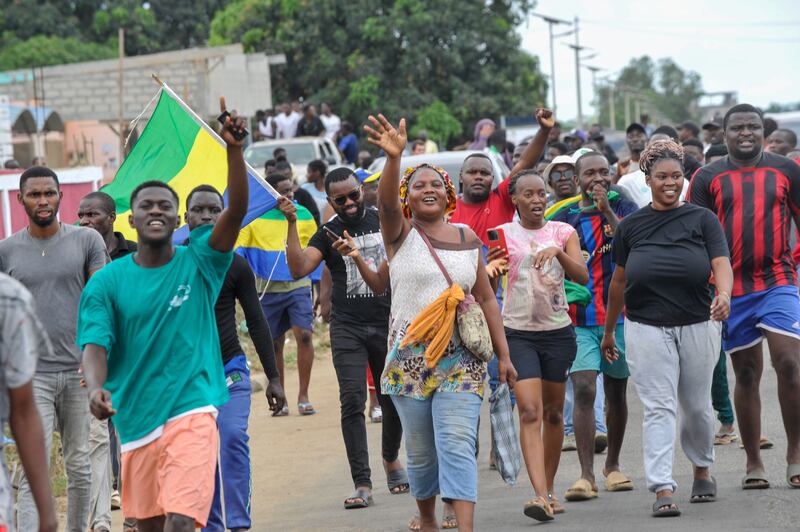 People celebrate in the streets of Akanda, Gabon, after a military coup. EPA