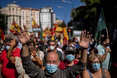 People take part in a protest against the increases in the price of electricity in Madrid, Spain. AP