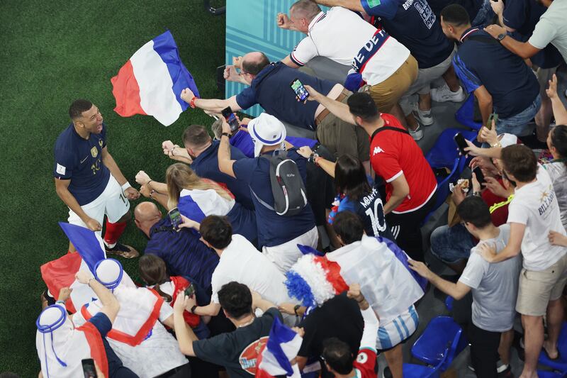 Kylian Mbappe with the France supporters. Getty
