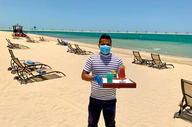 Face masks on the beach and socially-distanced sunbeds are some of the measures in place at hotels that are offering Eid staycation offers. Courtesy JA Hotels and Resorts