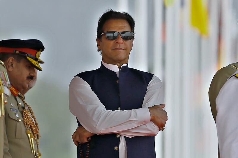 Pakistan's under-fire Prime Minister Imran Khan attends a military parade to mark National Day, in Islamabad. AP