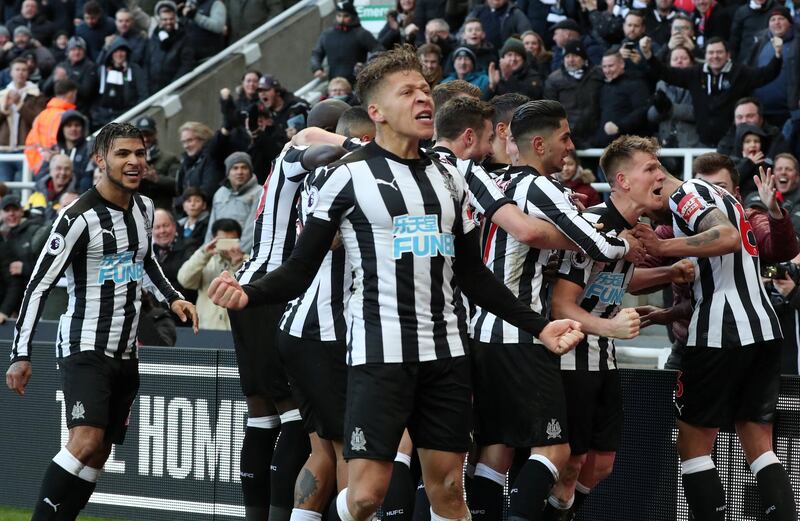 Soccer Football - Premier League - Newcastle United vs Manchester United - St James' Park, Newcastle, Britain - February 11, 2018   Newcastle United's Matt Ritchie celebrates scoring their first goal with Dwight Gayle and team mates    REUTERS/Scott Heppell    EDITORIAL USE ONLY. No use with unauthorized audio, video, data, fixture lists, club/league logos or "live" services. Online in-match use limited to 75 images, no video emulation. No use in betting, games or single club/league/player publications.  Please contact your account representative for further details.