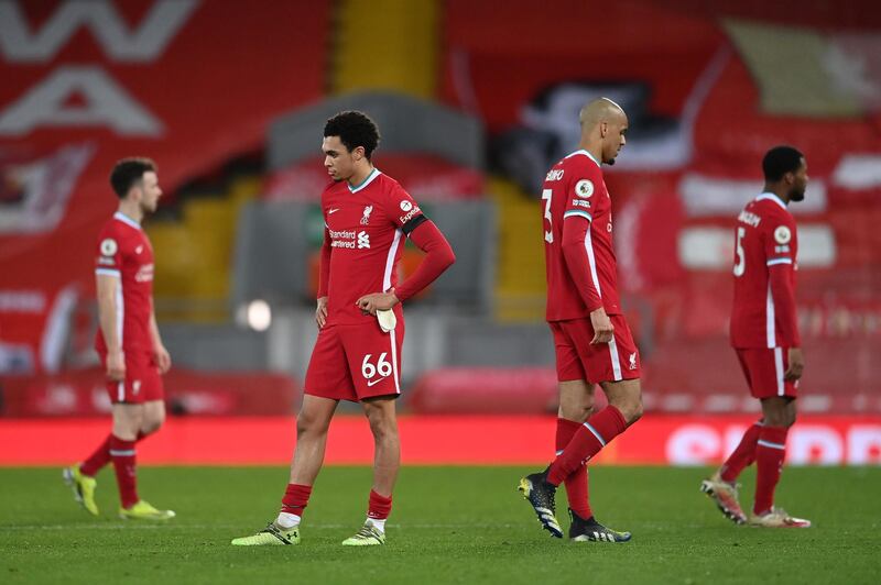 LIVERPOOL, ENGLAND - MARCH 04: Trent Alexander-Arnold of Liverpool and Fabinho of Liverpool look dejected following their team's defeat in the Premier League match between Liverpool and Chelsea at Anfield on March 04, 2021 in Liverpool, England. Sporting stadiums around the UK remain under strict restrictions due to the Coronavirus Pandemic as Government social distancing laws prohibit fans inside venues resulting in games being played behind closed doors. (Photo by Laurence Griffiths/Getty Images)