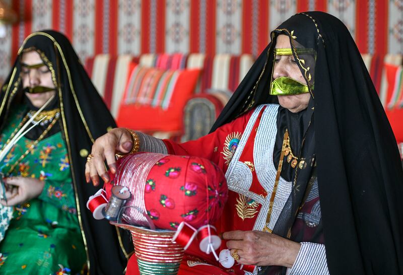 Women perform a traditional kind of embroidery known as talli for the Women’s Handicraft Centre in Abu Dhabi. Khushnum Bhandari / The National