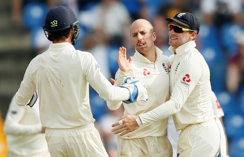 Cricket - England v Sri Lanka, Second Test - Pallekele, Sri Lanka - November 15, 2018. England's Jack Leach celebrates with his teammates after taking the wicket of Sri Lanka's Dilruwan Perera (not pictured). REUTERS/Dinuka Liyanawatte