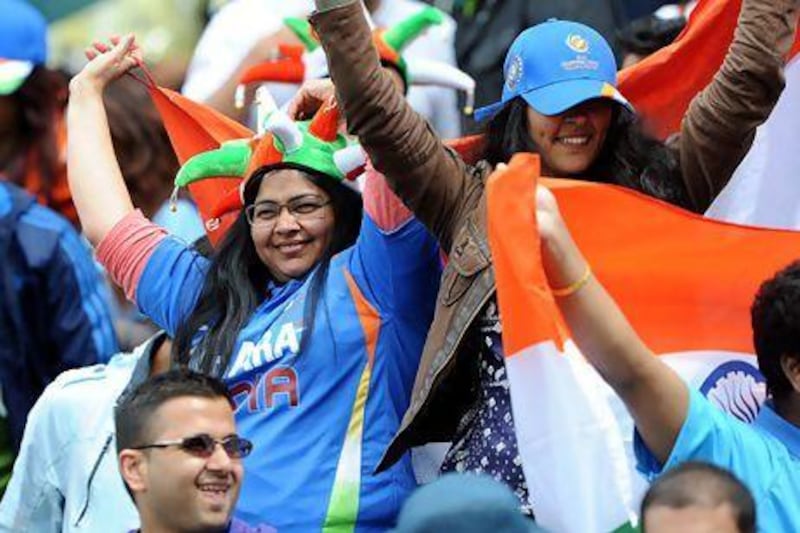 Indian fans cheer during the 2013 ICC Champions Trophy cricket match between Pakistan and India at Edgbaston in Birmingham lat month. Andrew Yates / AFP