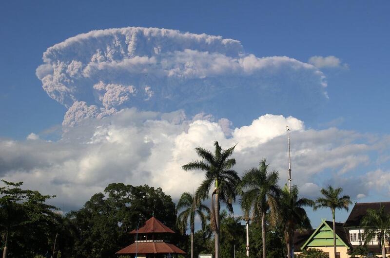 Agiant cloud of ash and steam rise from erupting Sangeang Api volcano seen from Bima town on Sumbawa island. Flights into and out of the northern Australian city of Darwin were cancelled, and some to Bali affected, after huge ash clouds were thrown up by an Indonesian volcano. Andy Amalda / AFP 