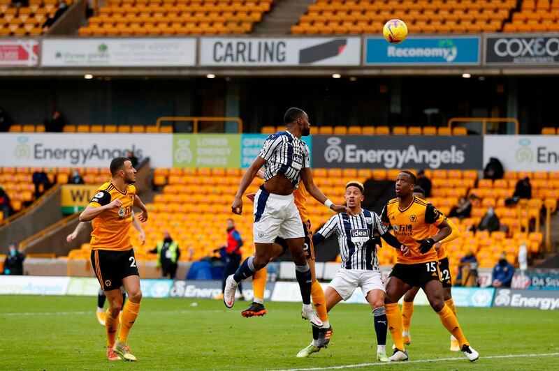 West Brom's Semi Ajayi makes it 2-2 at Molineux. AFP