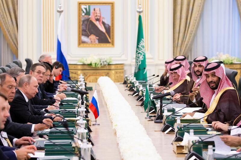 Prince Mohammed bin Salman speaks to Mr Putin during the talks. AP Photo