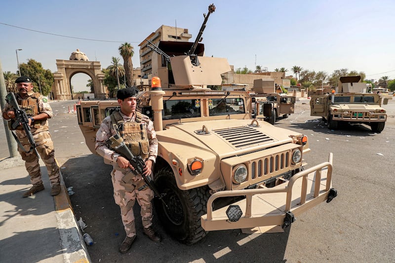 Iraqi soldiers guard the entrance of the high-security Green Zone in Baghdad. AFP