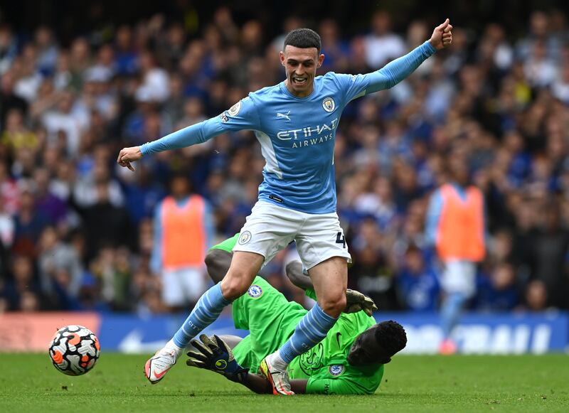 Chelsea goalkeeper Edouard Mendy saves at the feet of City's Phil Foden. Getty