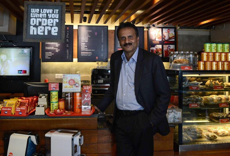 (FILES) In this file photo taken on October 8, 2015 coffee tycoon V.G. Siddhartha, owner of the Café Coffee Day chain, poses for a photograph at one of his coffeeshops in Ahmedabad. Indian police on July 30, 2019 launched a major hunt for one of the country's richest men, coffee tycoon V.G. Siddhartha, after he went missing amid mounting fears for his safety.
 / AFP / SAM PANTHAKY
