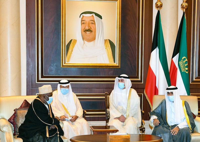 Emir Sheikh Nawaf Al Sabah receiving condolences from Comorian President Azali Assoumani in Kuwait City.  AFP
