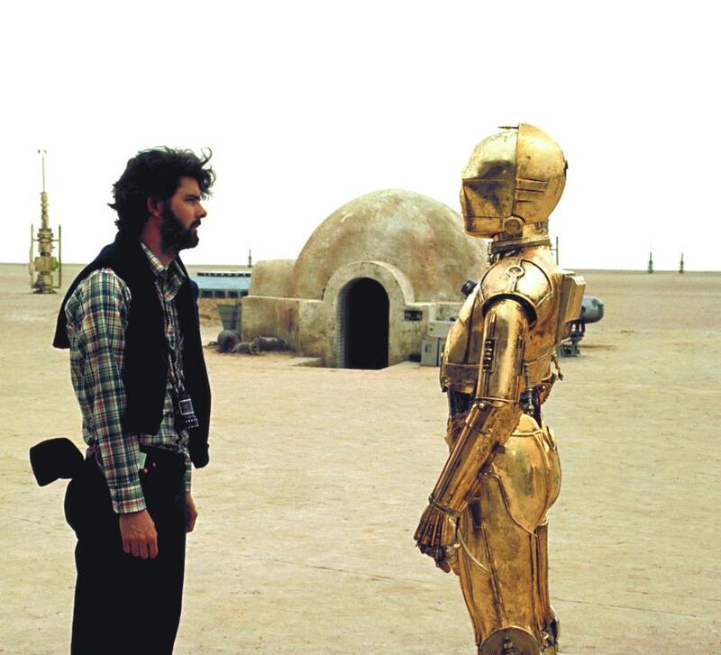 George Lucas, Star Wars creator, with Anthony Daniels (C-3PO) on the set of Star Wars: Episode IV – A New Hope (1977). The storytelling prowess of Lucas, who described his film as an ‘original compilation’, is chronicled in Hit Makers.  Sunset Boulevard / Corbis via Getty Images