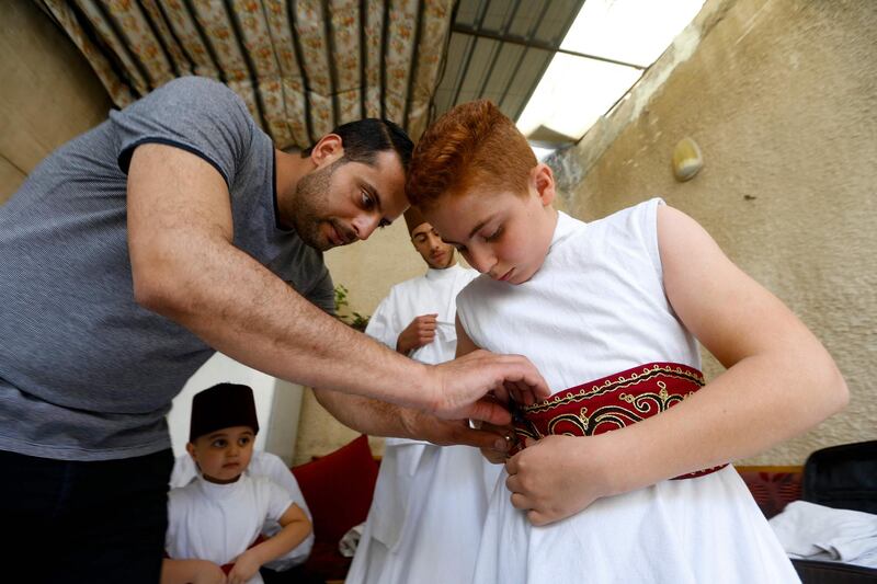 In Syria, members of the Al Kharrat family are one of the largest Damascene families trying to preserve the Sufi whirling ritual often performed in public during Ramadan.  AFP