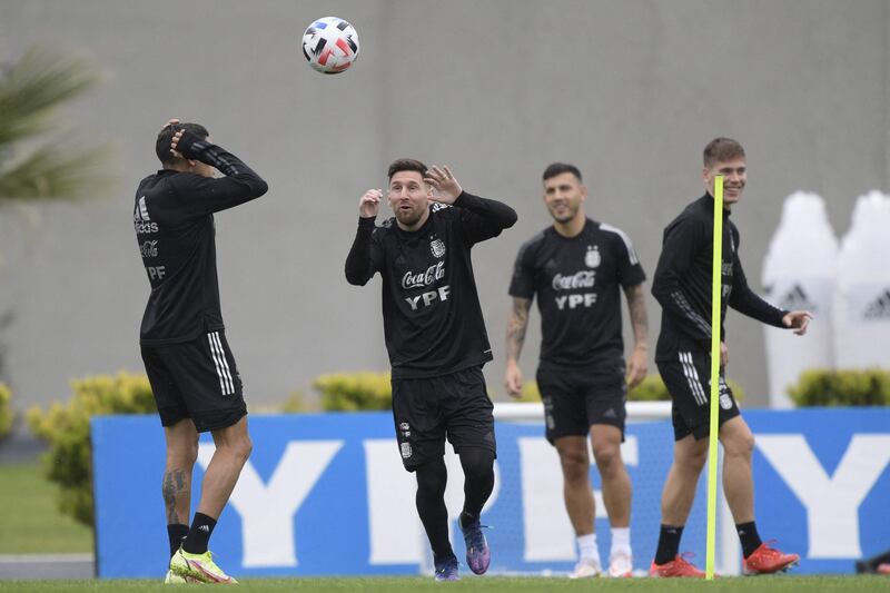 Lionel Messi eyes the ball next to defender Nahuel Molina, Juan Foyth and midfielder Leandro Paredes. AFP