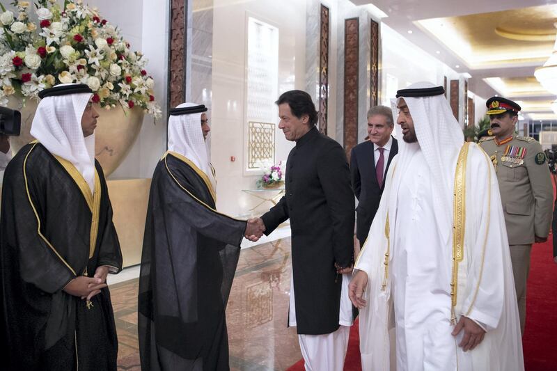 ABU DHABI, UNITED ARAB EMIRATES - September 19, 2018: HH Lt General Sheikh Saif bin Zayed Al Nahyan, UAE Deputy Prime Minister and Minister of Interior (2nd L), greets HE Imran Khan, Prime Minister of Pakistan (C), during a reception at the Presidential Airport. Seen with HH Sheikh Mohamed bin Zayed Al Nahyan, Crown Prince of Abu Dhabi and Deputy Supreme Commander of the UAE Armed Forces (R) and HH Sheikh Mansour bin Zayed Al Nahyan, UAE Deputy Prime Minister and Minister of Presidential Affairs (L). 

( Saeed Al Neyadi / Crown Prince Court - Abu Dhabi )
---