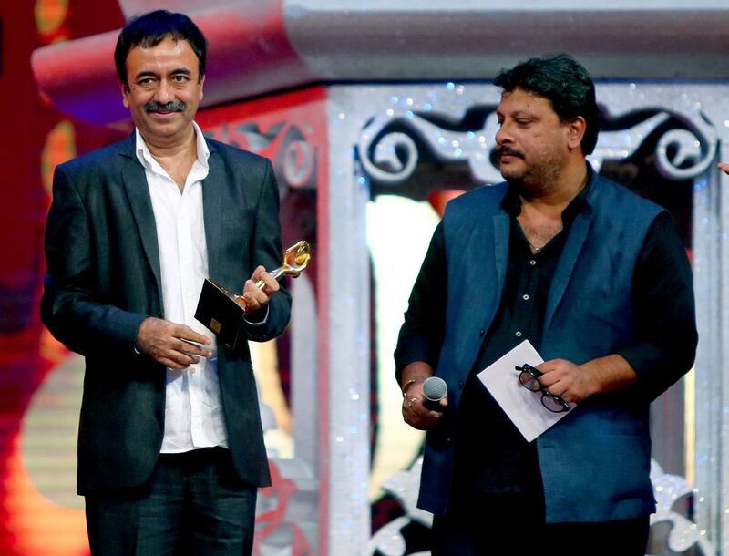 Indian film director Rajkumar Hirani holds his “best film” award for “PK” during the Arab Indo Bollywood Awards ceremony. AFP