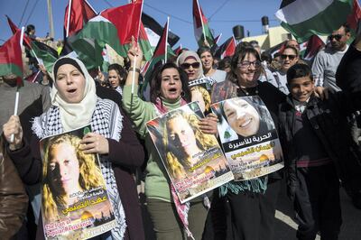 Palestinians march holding  posters of Ahed Tamimi and her mother during a demonstration in the Palestinian village of Nabi Salah on January 13,2018.

Ahed was arrested in mid December after a video went viral on Facebook showing her confronting Israeli soldiers outside her home .Her mother and cousin and other family members were also detained .She is being called the icon of Palestinian resistance . Palestinians and Israeli and foreign activists held a demonstration in support of Ahed and other Palestinians in Israeli jails .The demonstration erupted in violence with Israeli forces.(Photo by Heidi Levine for The National).