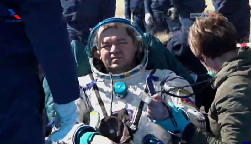 A grab from video footage released by Roscosmos space agency shows Russian cosmonaut Oleg Skripochka shortly after returning from the International Space Station aboard the Soyuz MS-15 space capsule near the town of Dzhezkazgan, Kazakhstan on April 17, 2020. Roscosmos Space Agency via AP