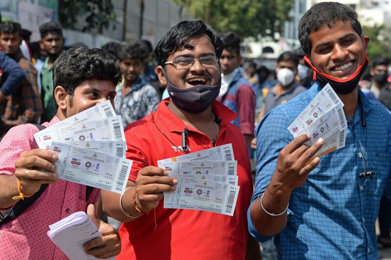 Cricket fans display tickets for the second Test match between India and England at the M.A. Chidambaram Stadium in Chennai on Thursday, February 11, 2021. AFP