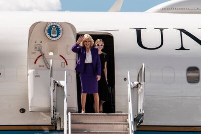 Ms Biden waves as she and her granddaughter Naomi Biden arrive at the Hosea Kutako International Airport in Windhoek. AFP