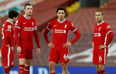Soccer Football - Premier League - Liverpool v Brighton & Hove Albion - Anfield, Liverpool, Britain - February 3, 2021  Liverpool's Jordan Henderson, Trent Alexander-Arnold and Thiago Alcantara look dejected after conceding their first goal Pool via REUTERS/Phil Noble EDITORIAL USE ONLY. No use with unauthorized audio, video, data, fixture lists, club/league logos or 'live' services. Online in-match use limited to 75 images, no video emulation. No use in betting, games or single club /league/player publications.  Please contact your account representative for further details.     TPX IMAGES OF THE DAY