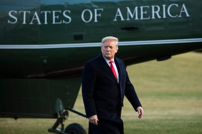 President Donald Trump arrives at the White House, Friday, Feb. 7, 2020, in Washington, as he returns from a trip to Charlotte, N.C. (AP Photo/Manuel Balce Ceneta)