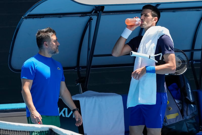 Serbia's Novak Djokovic takes a drink during a practice session on Rod Laver Arena.  AP Photo