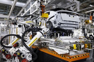 Nissan Ariya electric crossover sport utility vehicles being assembled by robots at the company's plant in Japan. Bloomberg