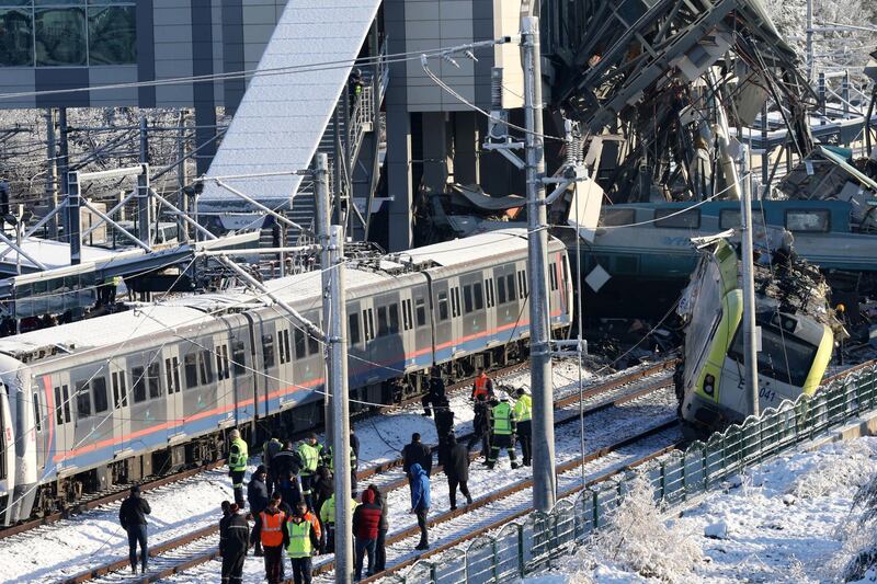 Firefighters and medics try to rescue victims after a high speed train accident in Ankara, Turkey. EPA