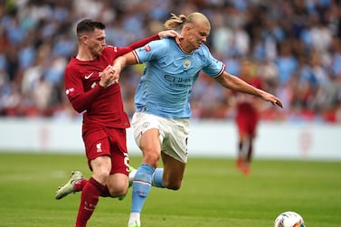 Manchester City's Erling Haaland and Liverpool's Andrew Robertson battle for the ball during the FA Community Shield match at the King Power Stadium, Leicester. Picture date: Saturday July 30, 2022.