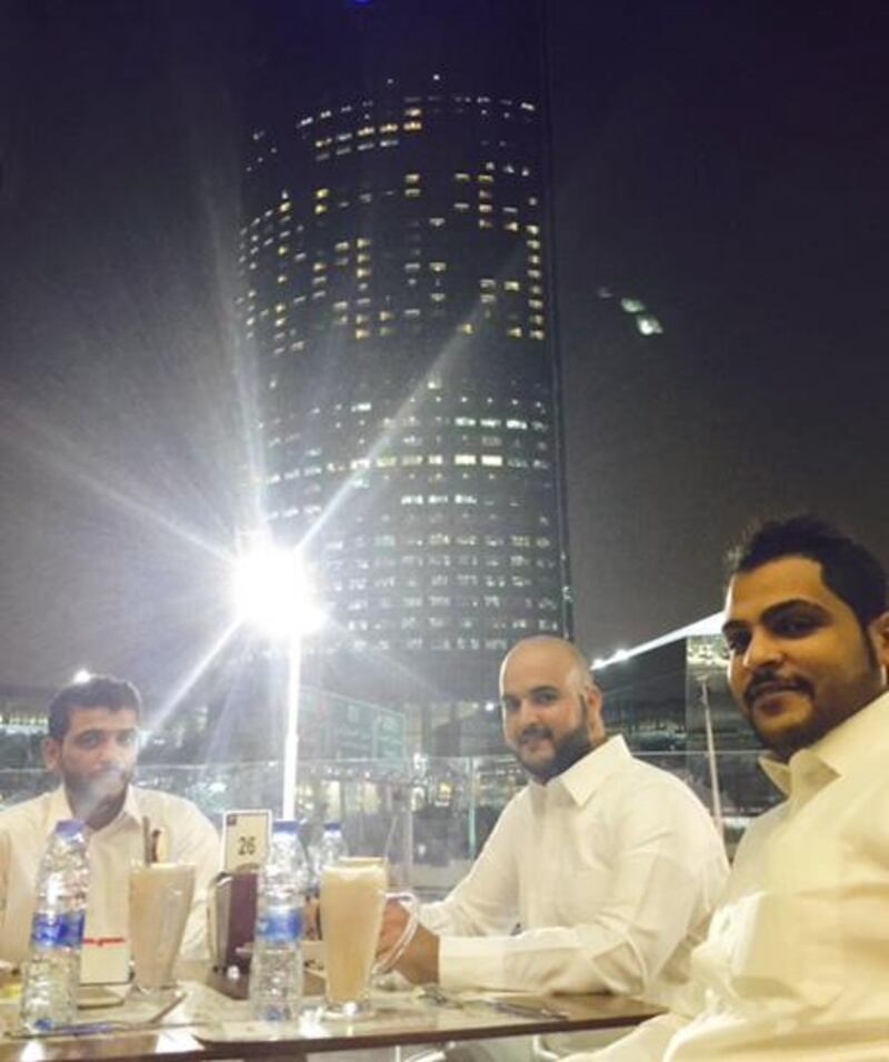 (From left) Sultan Al-Shammari, Sultan Al-Otaiba and Amer Al-Shammari relax on the terrace of the Al Masaa Cafe in downtown Riyadh. Sean Cronin for The National