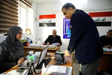 An Iraqi man updates his voter ID registration at an Independent High Electoral Commission center in Baghdad, Iraq January 20, 2021. Reuters 