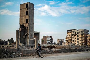 A man rides his bicycle in the northern Syrian city of Raqqa last week. AFP