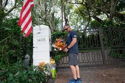 Logan Nichols vacationing from California drops off a bouquet of flowers at the home of talk radio host Rush Limbaugh, Wednesday, Feb. 17, 20121 in Palm Beach, Fla. Limbaugh, 70, died this morning of lung cancer. (AP Photo/Marta Lavandier)