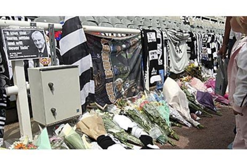 Tributes to former manager Bobby Robson placed by Newcastle United fans are seen at the club's stadium yesterday.