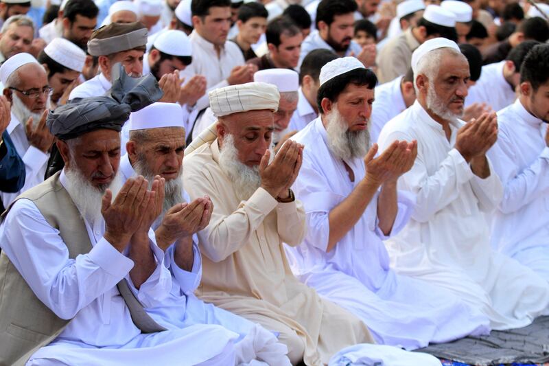 People attend Eid al-Fitr prayers to mark the end of the holy fasting month of Ramadan in a park in Peshawar, Pakistan June 25, 2017. REUTERS/ Fayaz Aziz