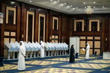 Emirati men cast their votes during the Federal National Council elections at a polling centre in Dubai on Saturday. Mahmoud Khaled / EPA