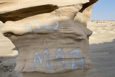 Petrified sand formations at Al Wahtba, Abu Dhabi, formed over thousands of years, have been defaced by graffiti. Courtesy: Hannah Androulaki-Khan
