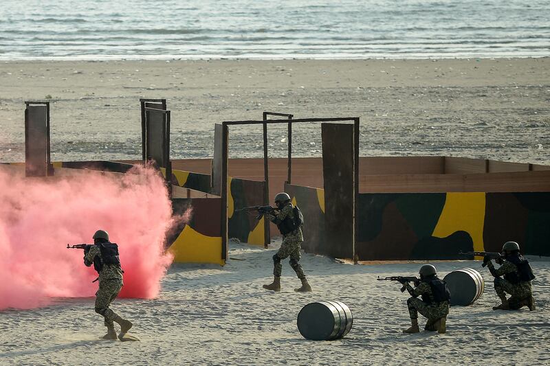 Pakistani soldiers take part in a drill during the International Defence Exhibition and Seminar. AFP