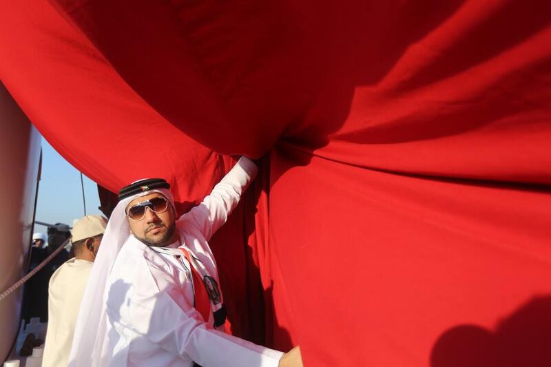 A large UAE flag is launched in Ras al Khaimah as residents celebrate UAE’s National Day. Sammy Dallal / The National