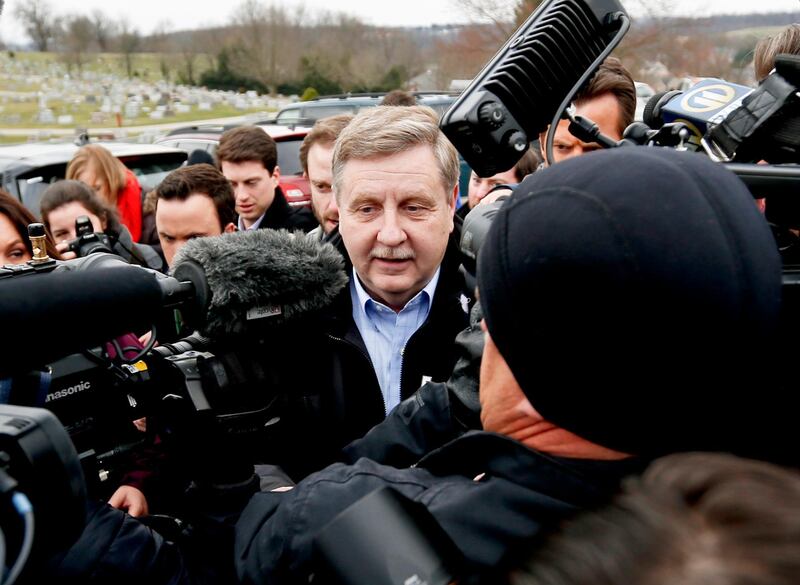 FILE - In this Tuesday, March 13, 2018, file photo, Republican Rick Saccone, center, is surrounded by media as he heads to a polling place in McKeesport, Pa., to cast his ballot in a special U.S. House election. Saccone lost the election to Democrat Conor Lamb. (AP Photo/Keith Srakocic, File)
