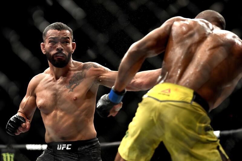 Dan Ige, left, of the United States fights Edson Barboza of Brazil in their Featherweight bout during UFC Fight Night at VyStar Veterans Memorial Arena. AFP