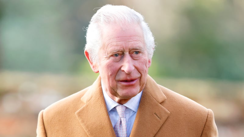 King Charles III in a camel wool overcoat that his father wore in the 1950s. Max Mumby / Indigo