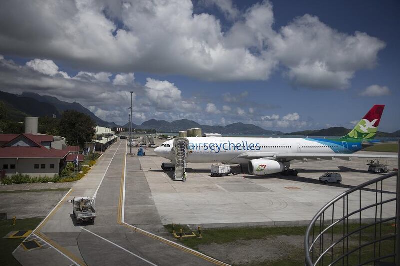 An Air Seychelles plane stands parked, undergoing servicing, at Victoria airport. Silvia Razgova / The National
