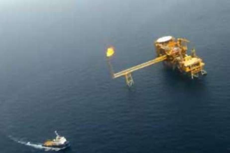 A file picture taken May 16, 2004, shows an aerial view of Iran's Balal offshore oil platform in the Gulf near the sea border with Qatar's territorial waters. When veteran prospector G B Reynolds hit a gusher on May 26, 1908, on a final attempt to find oil in Iran, he transformed the country's economy and history in an instant. A century later, Iran is sitting on the world's second-largest proven reserves of oil and is OPEC's number two exporter. AFP PHOTO/BEHROUZ MEHRI 