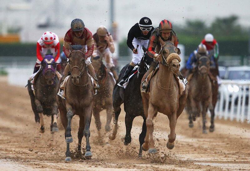 Patrick Dobbs riding Second Summer, right, wins the Godolphin Mile. Francois Nel / Getty Images