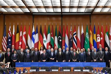 Secretary of Sate Mike Pompeo, center, and other foreign ministers and foreign officials pose for a family photo at the State Department in Washington, Thursday, Nov. 14, 2019, for the Global Coalition to Defeat ISIS Small Group Ministerial meeting. (AP Photo/Susan Walsh)